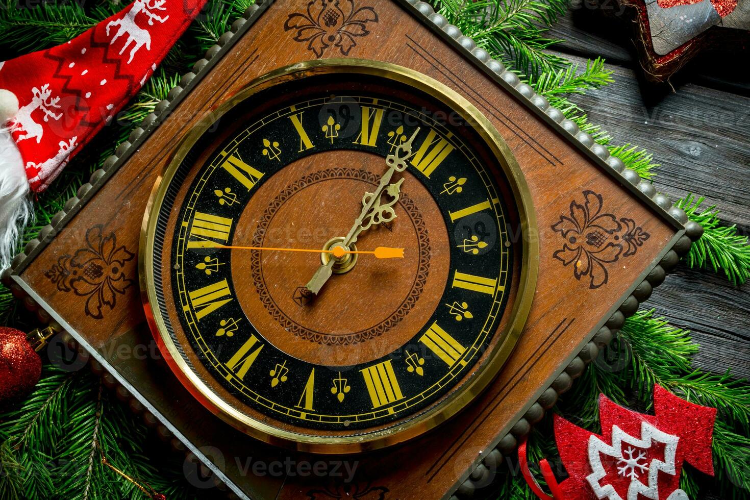 Natale orologio mostrando uno minuto per mezzanotte. foto