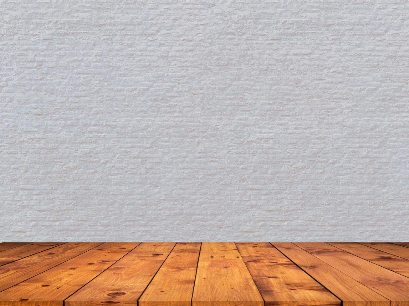 muro di mattoni bianchi con pavimento in legno zoom sullo sfondo del display del prodotto foto