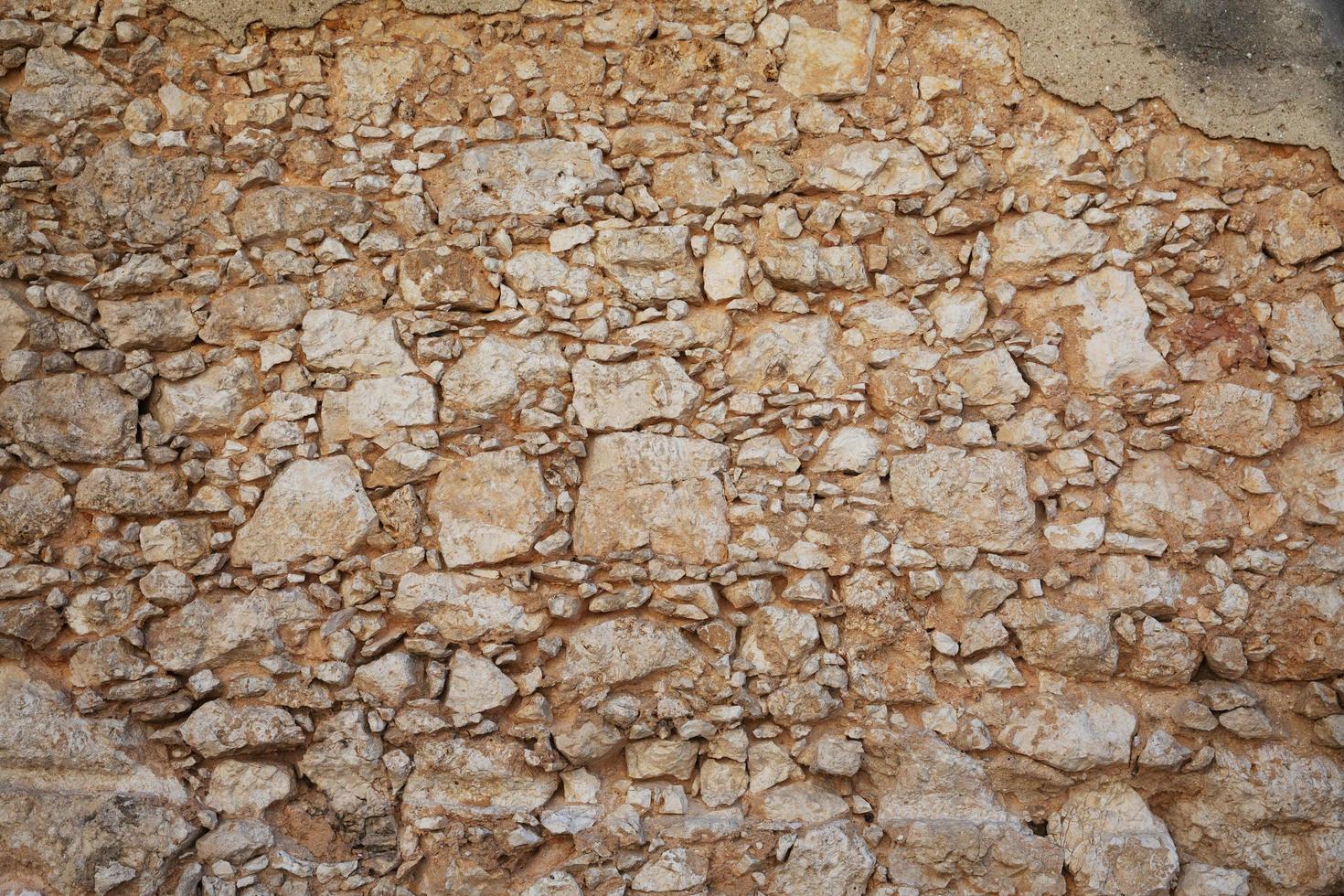 frammento di un vecchio muro di pietra foto