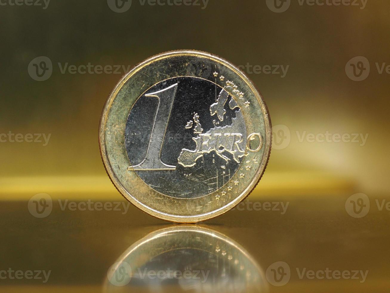 Moneta da 1 euro, unione europea su fondo oro foto