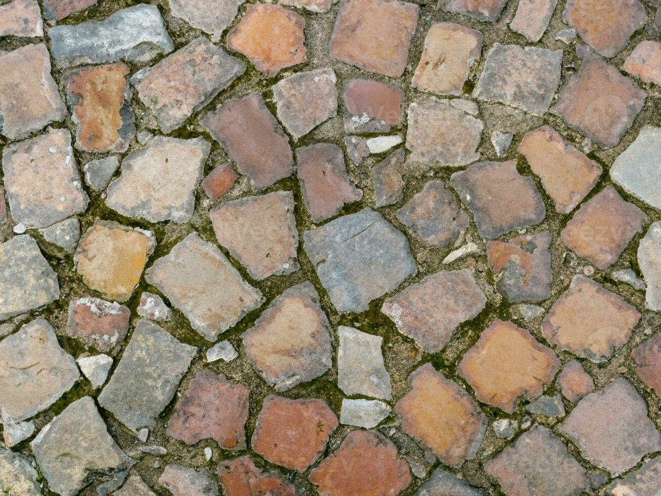 vicino su vecchio pietra marciapiede struttura foto