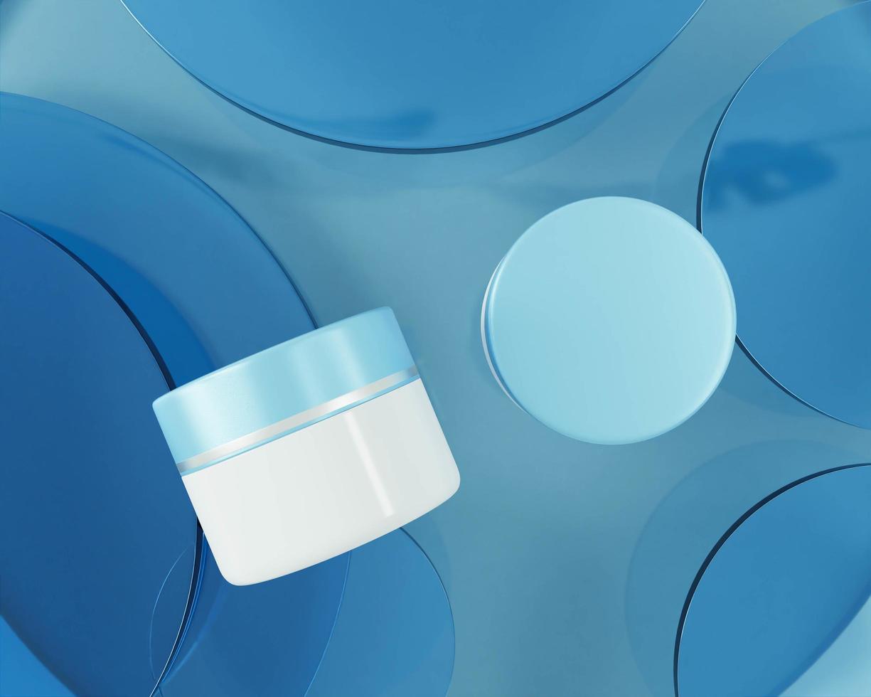 un vasetto di crema bianca posto su uno sfondo blu foto