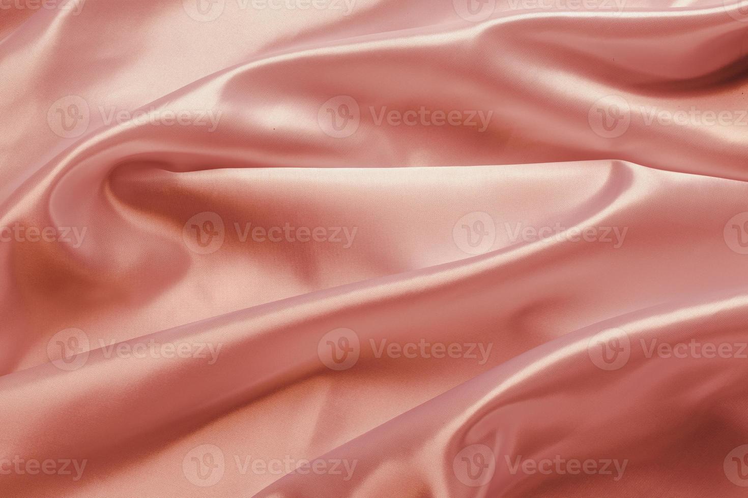 panno di seta satinato oro rosa astratto per lo sfondo foto