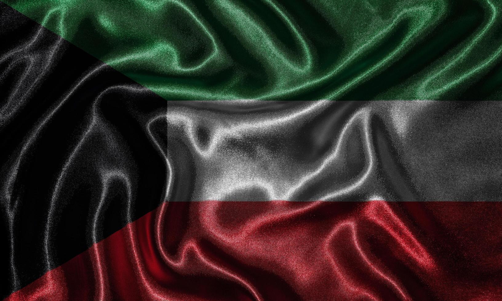 carta da parati della bandiera del kuwait e sventolando la bandiera del tessuto. foto