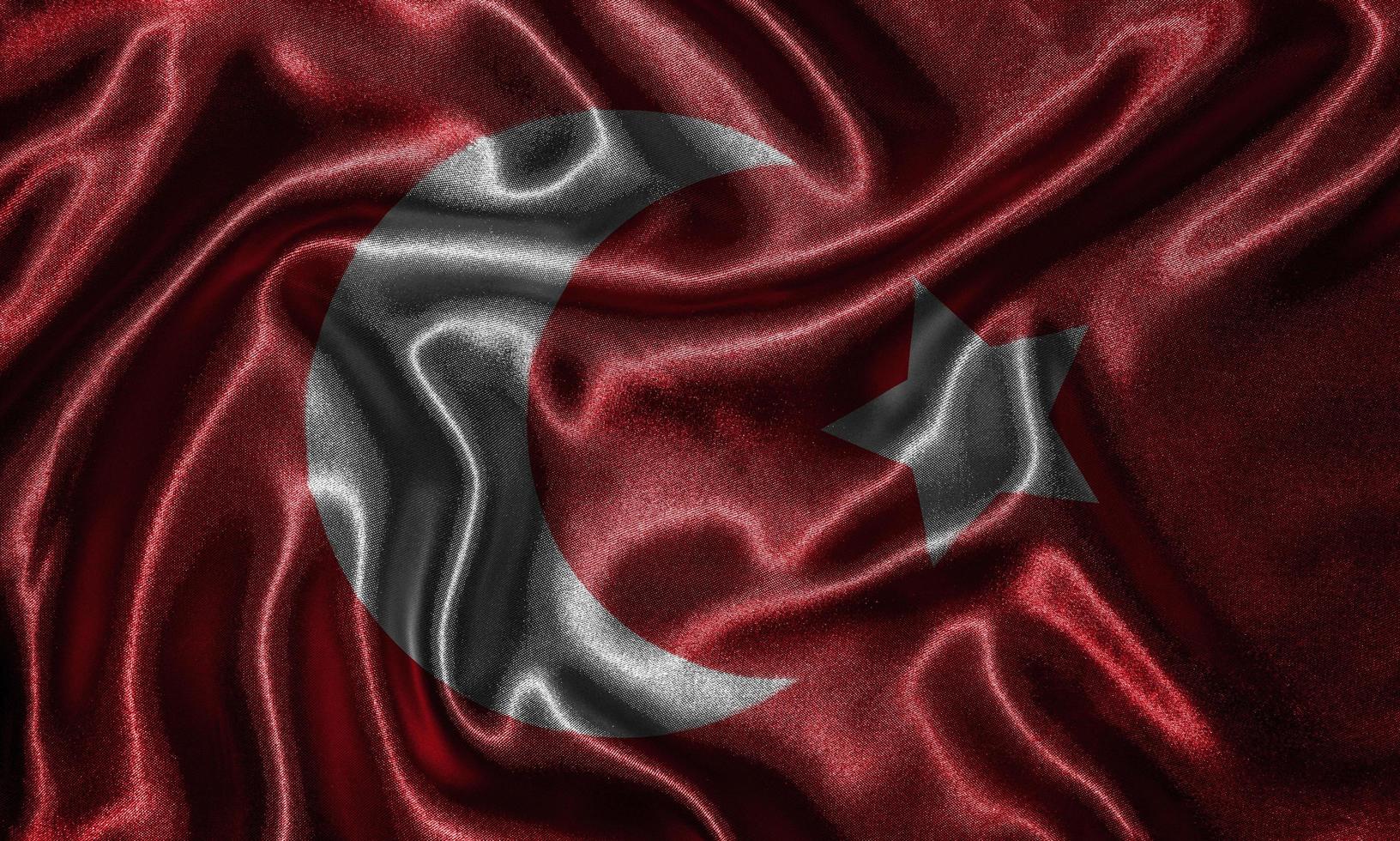 carta da parati della bandiera della Turchia e sventolando la bandiera del tessuto. foto