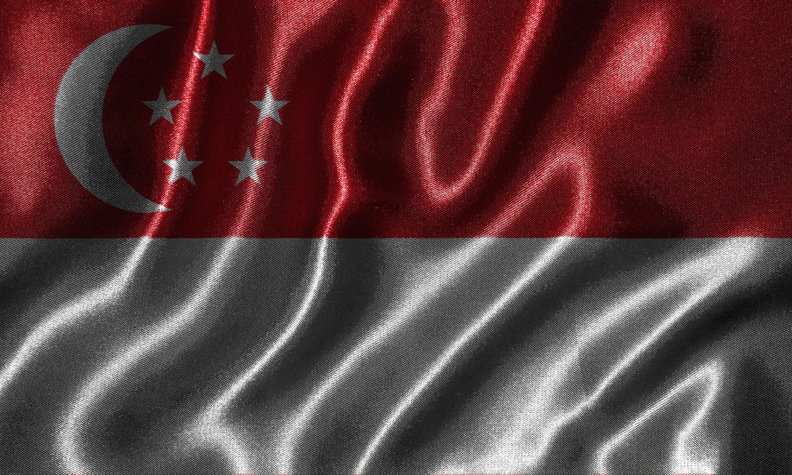 carta da parati della bandiera di Singapore e sventolando la bandiera del tessuto. foto