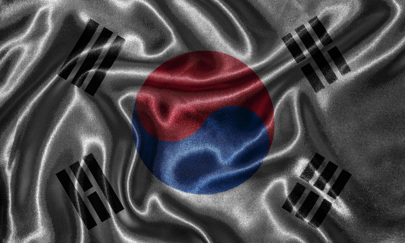 carta da parati della bandiera della corea del sud e sventolando la bandiera del tessuto. foto