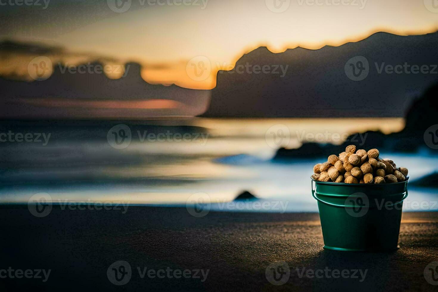 un' secchio di arachidi su il spiaggia a tramonto. ai-generato foto