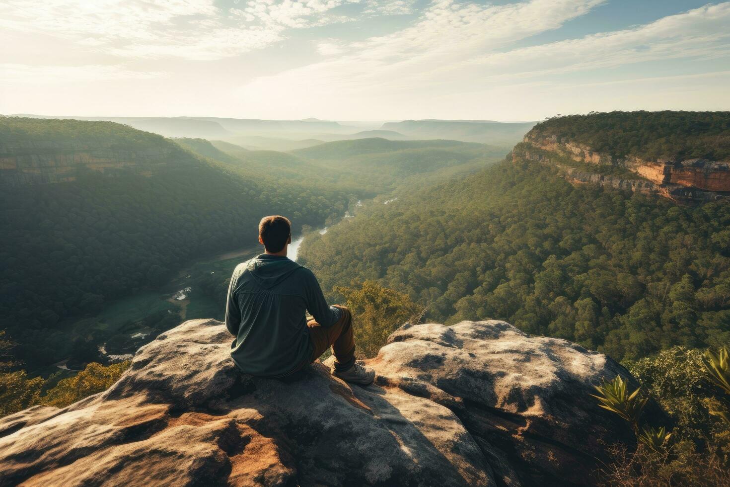 uomo seduta su il bordo di scogliera e guardare a il valle, uomo seduta su scogliera bordo solo godendo aereo Visualizza backpacking stile di vita viaggio avventura all'aperto, ai generato foto