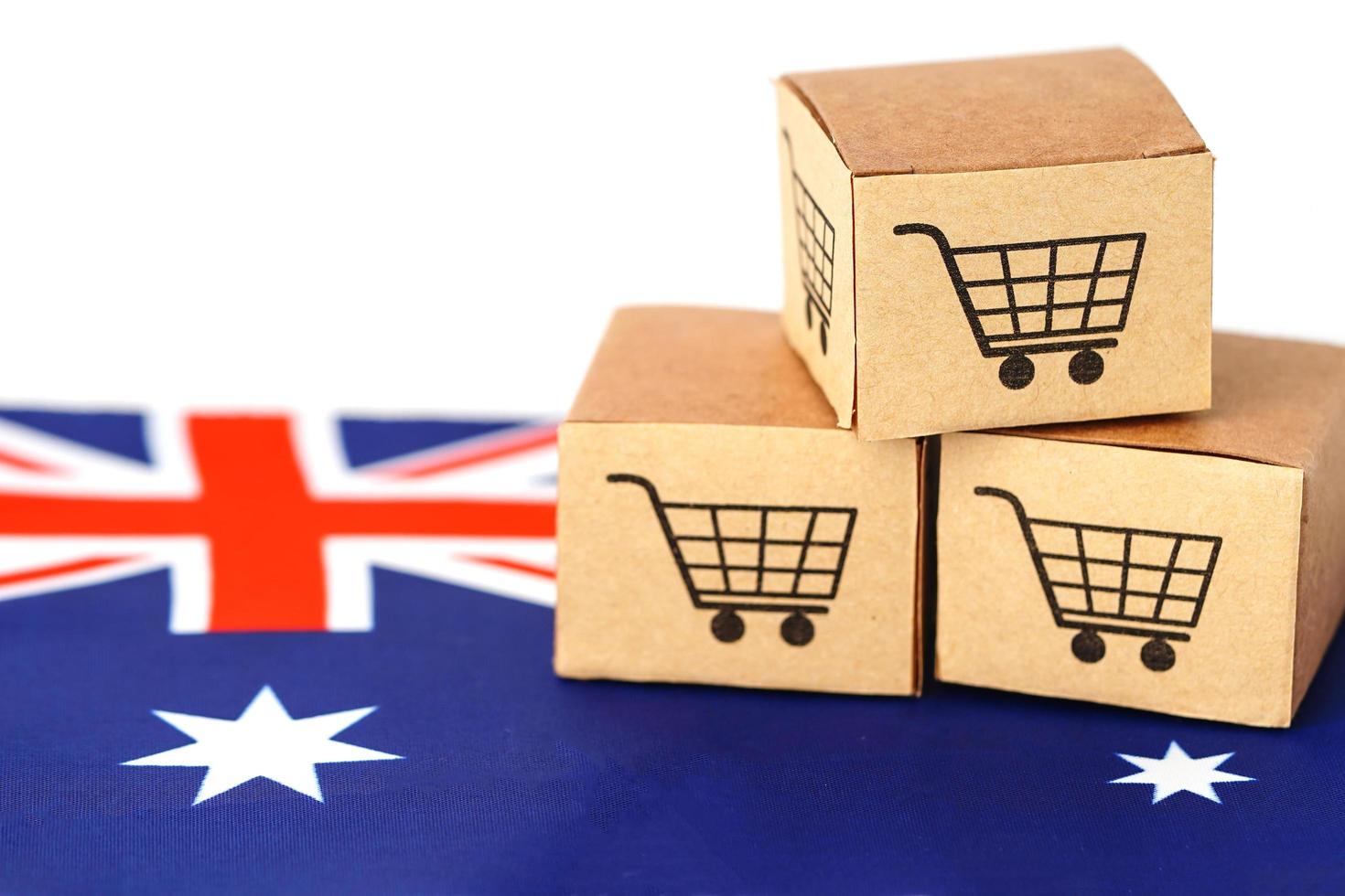 scatola del carrello della spesa sulla bandiera dell'australia, import export foto