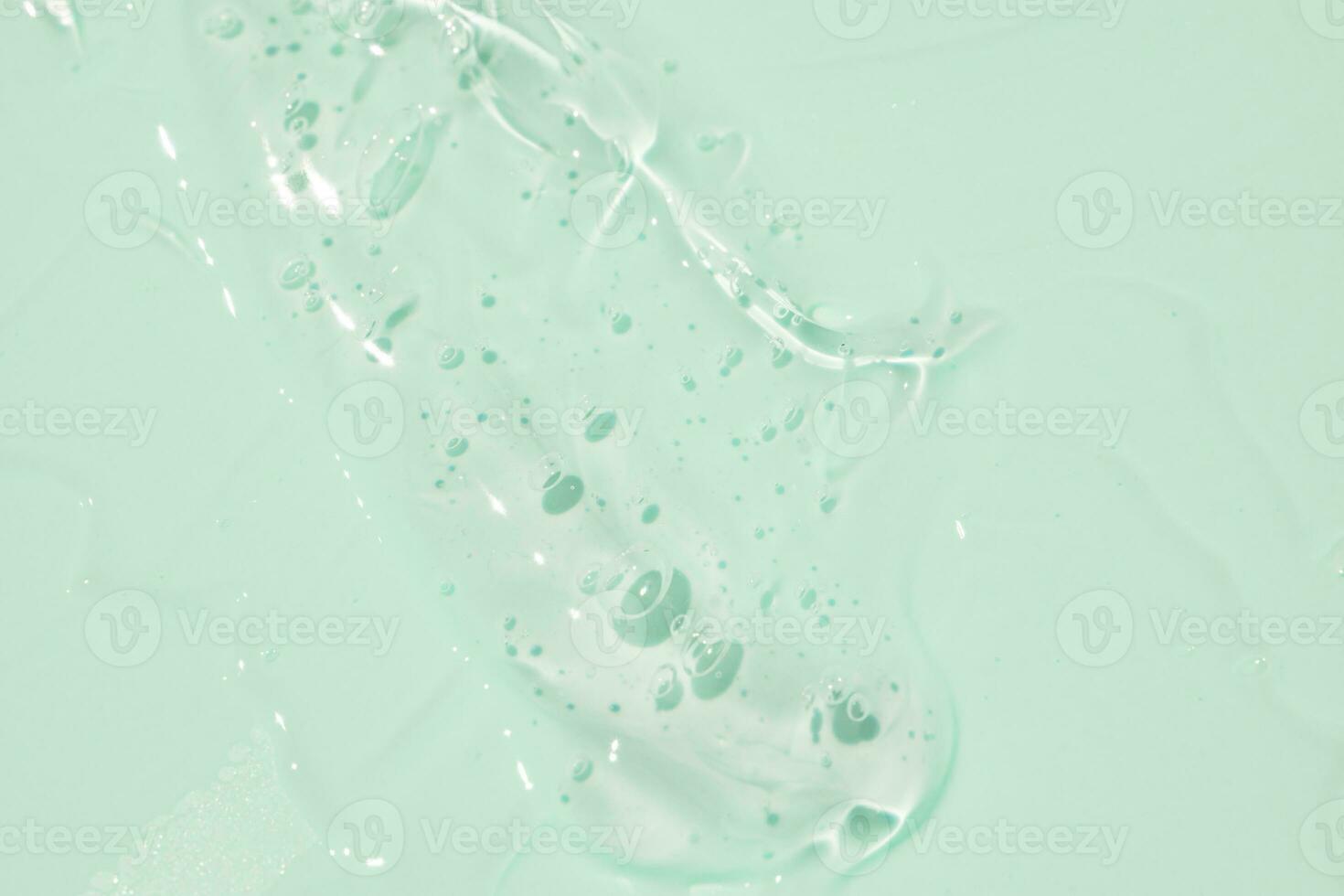struttura sfondo di cosmetico trasparente siero. cosmetico gel per pelle e corpo cura foto