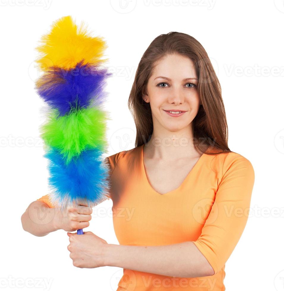 donna con un pennello per pulire la polvere foto