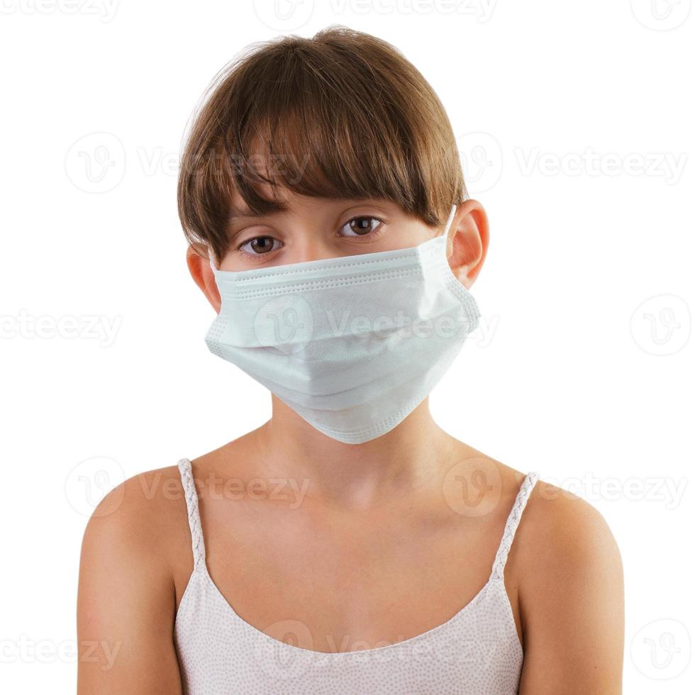 ragazza triste con una maschera medica foto