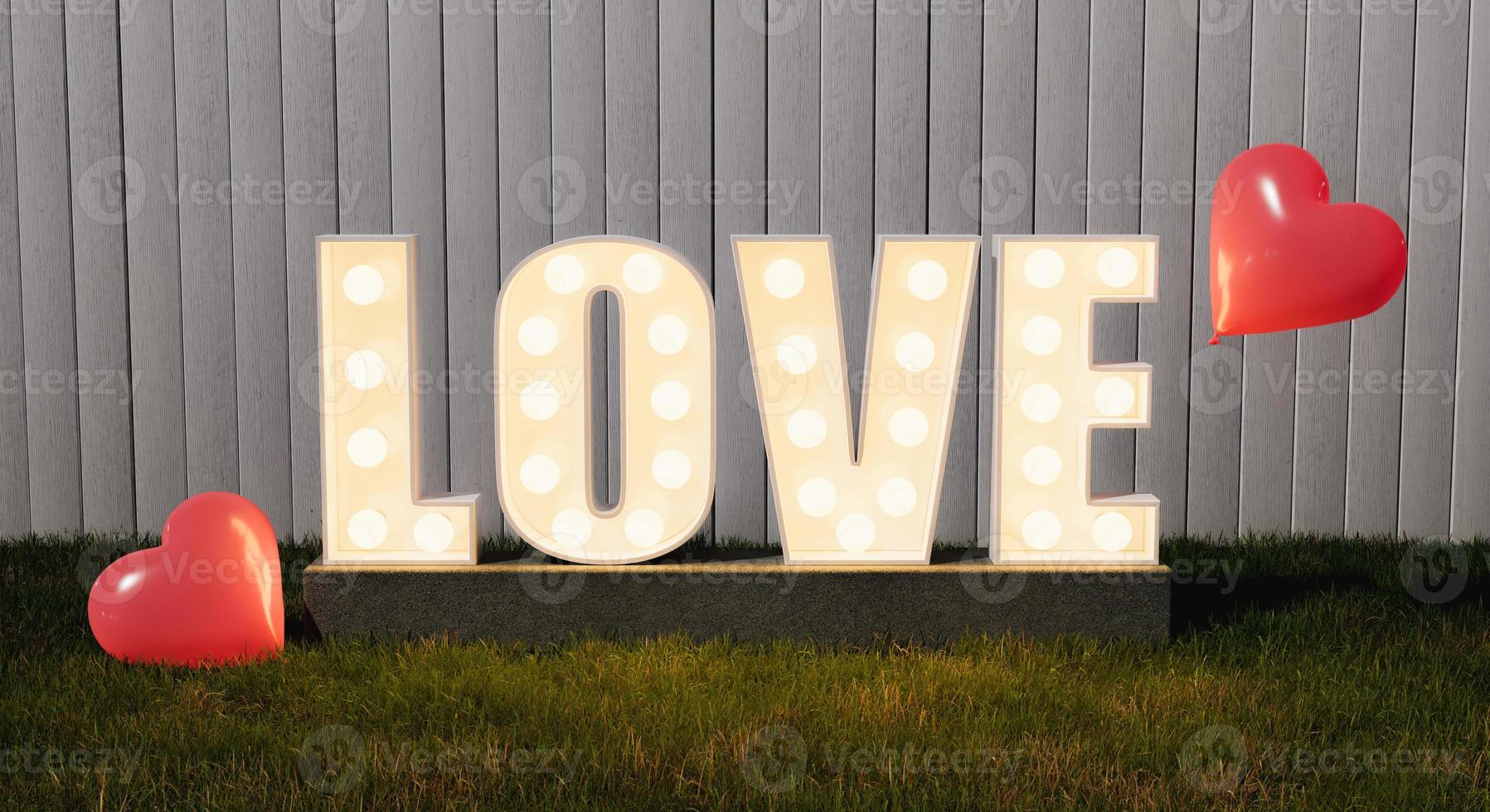 cartello d'amore con lampadine su un giardino foto