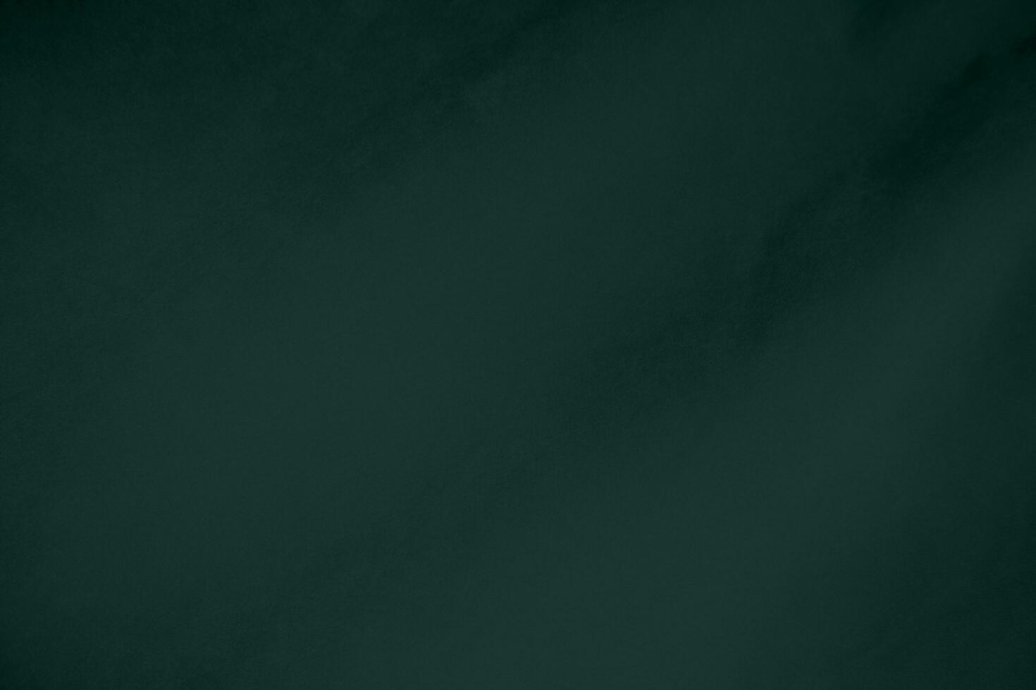 verde velluto tessuto struttura Usato come sfondo. Smeraldo colore felpa tessuto sfondo di morbido e liscio tessile Materiale. schiacciato velluto .lusso Smeraldo tono per seta.. foto