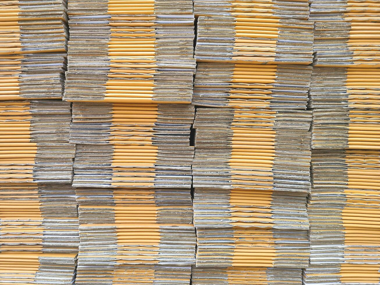 sfondo di molti Marrone pieghevole cartone scatole pila per confezione foto