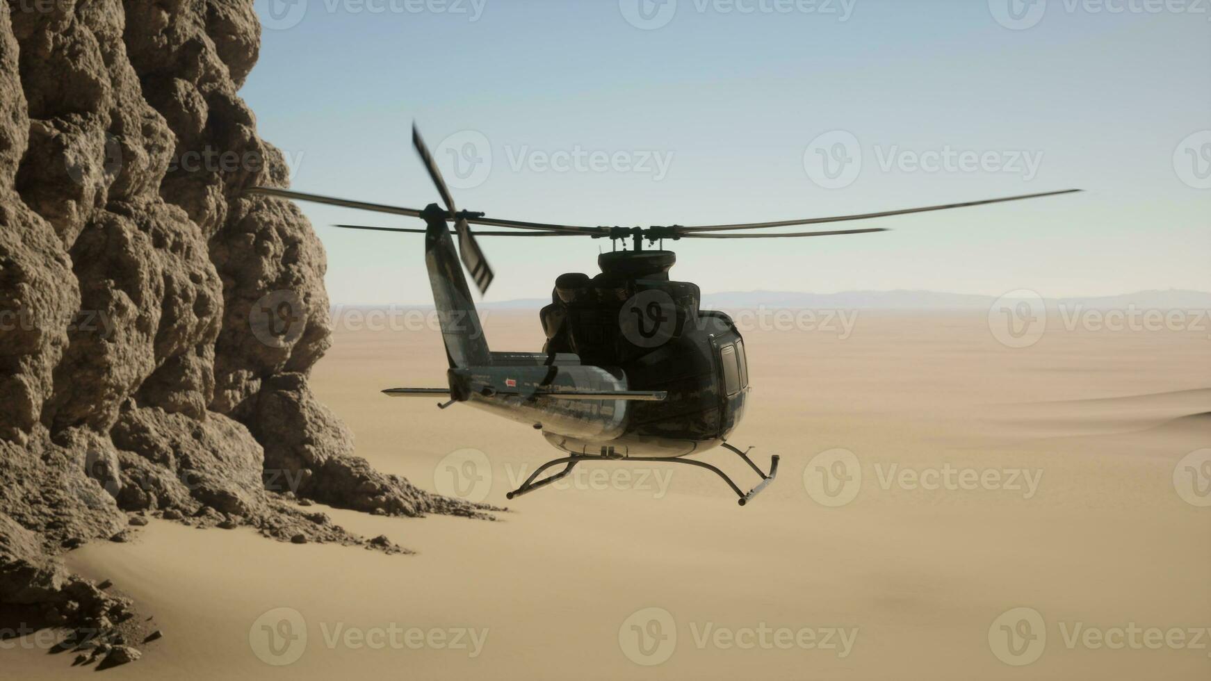 un' elicottero volante al di sopra di un' roccioso scogliera nel il deserto foto