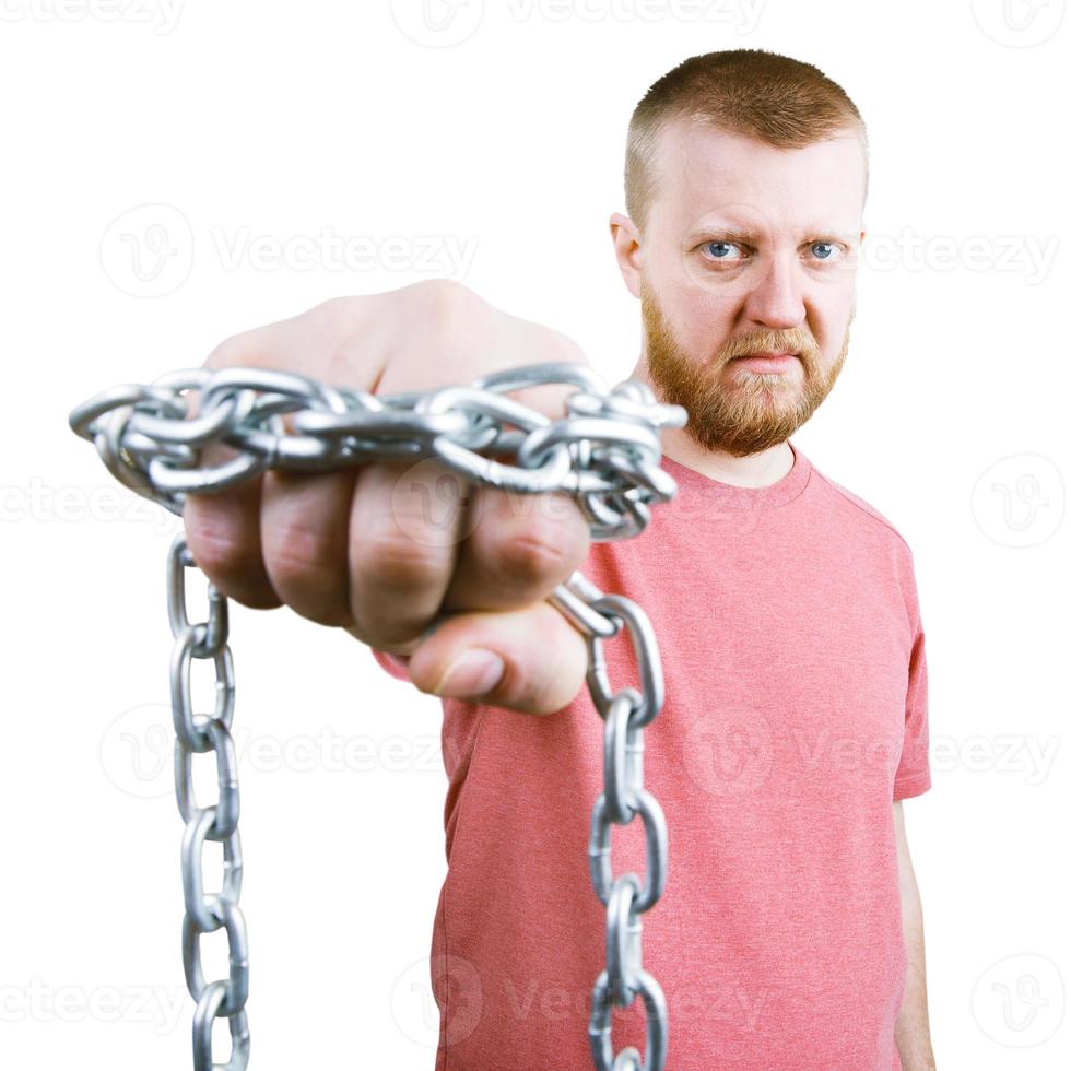 uomo barbuto con una catena intorno al pugno foto