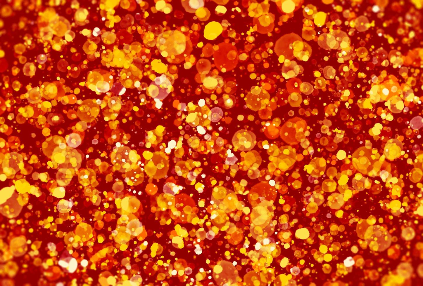 particelle d'oro glitter su sfondo rosso. foto