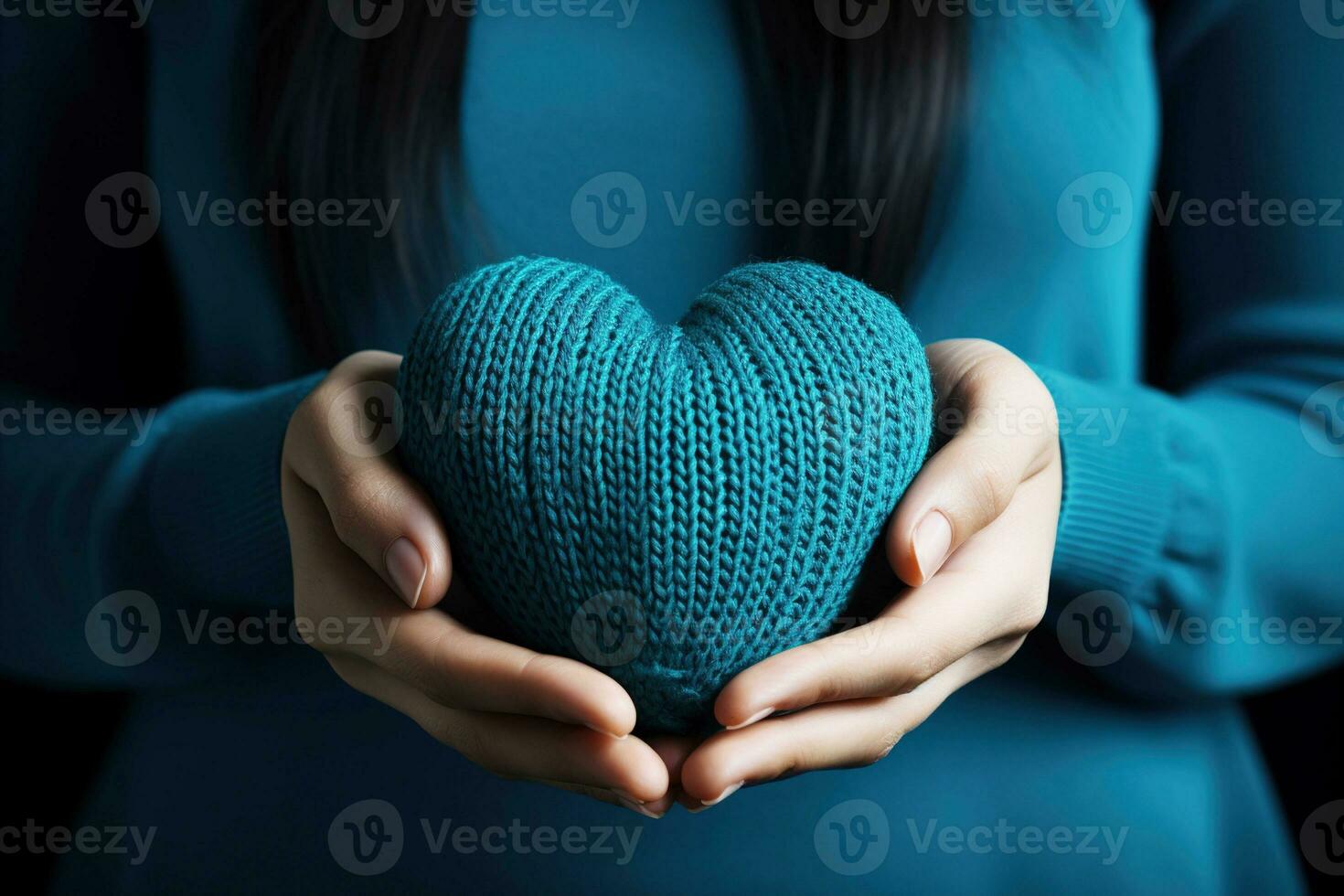 ai generato donna Tenere blu a maglia cuore nel sua mani foto