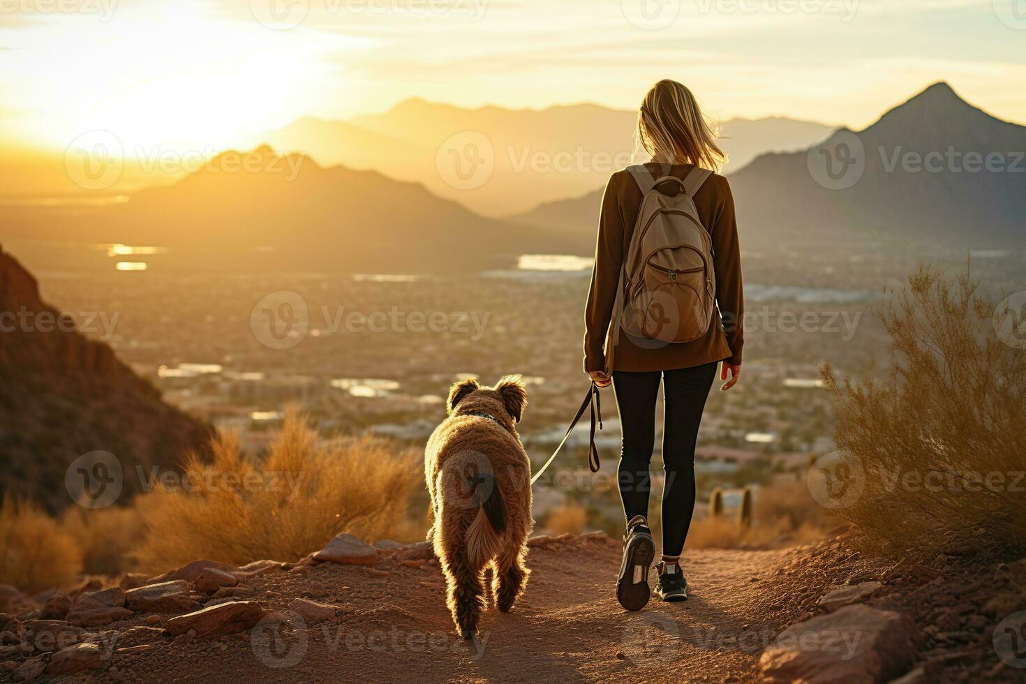 ai generato giovane in forma donna a piedi cane nel montagne foto