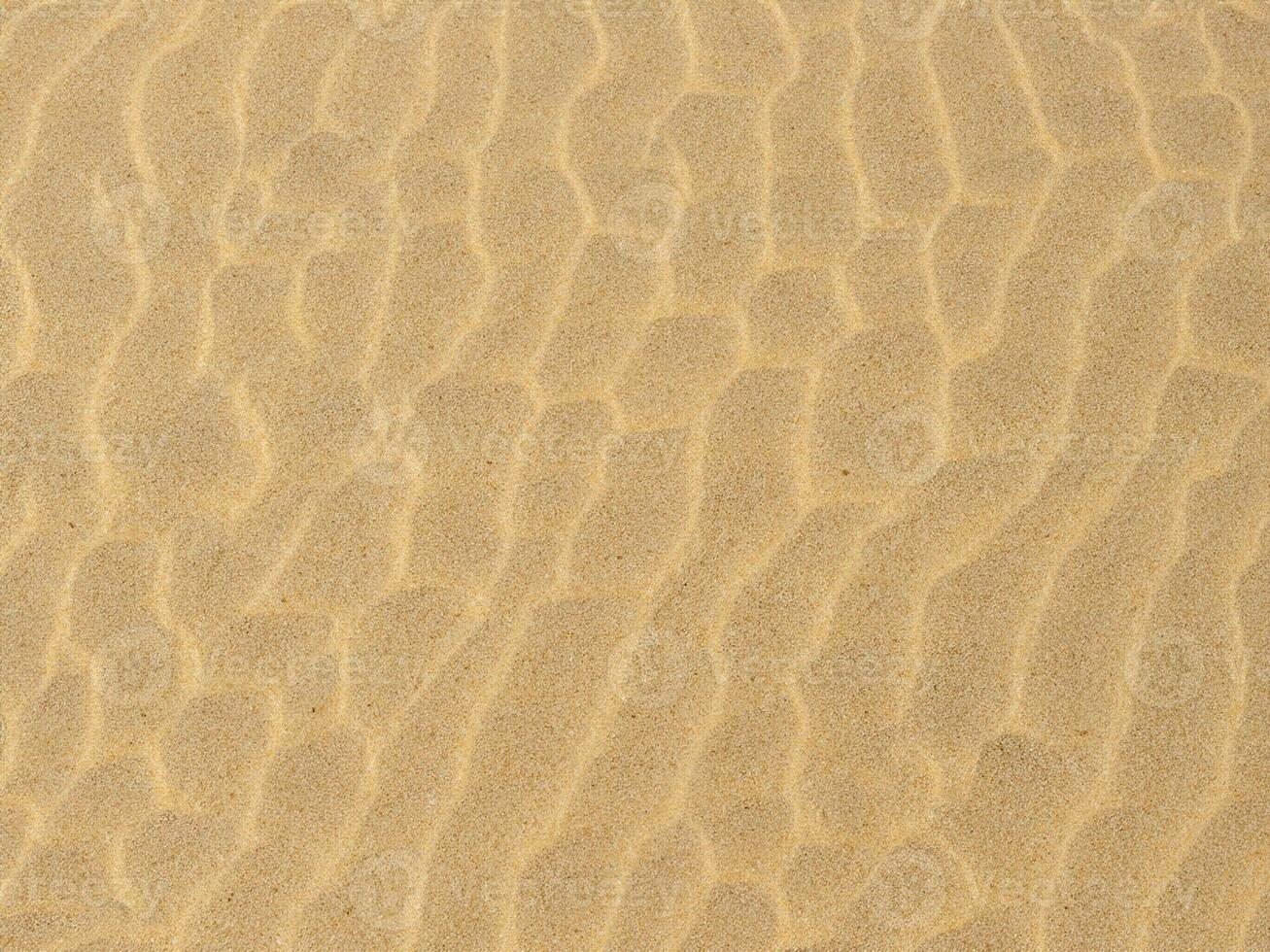 consistenza della sabbia. spiaggia sabbiosa per lo sfondo. vista dall'alto foto