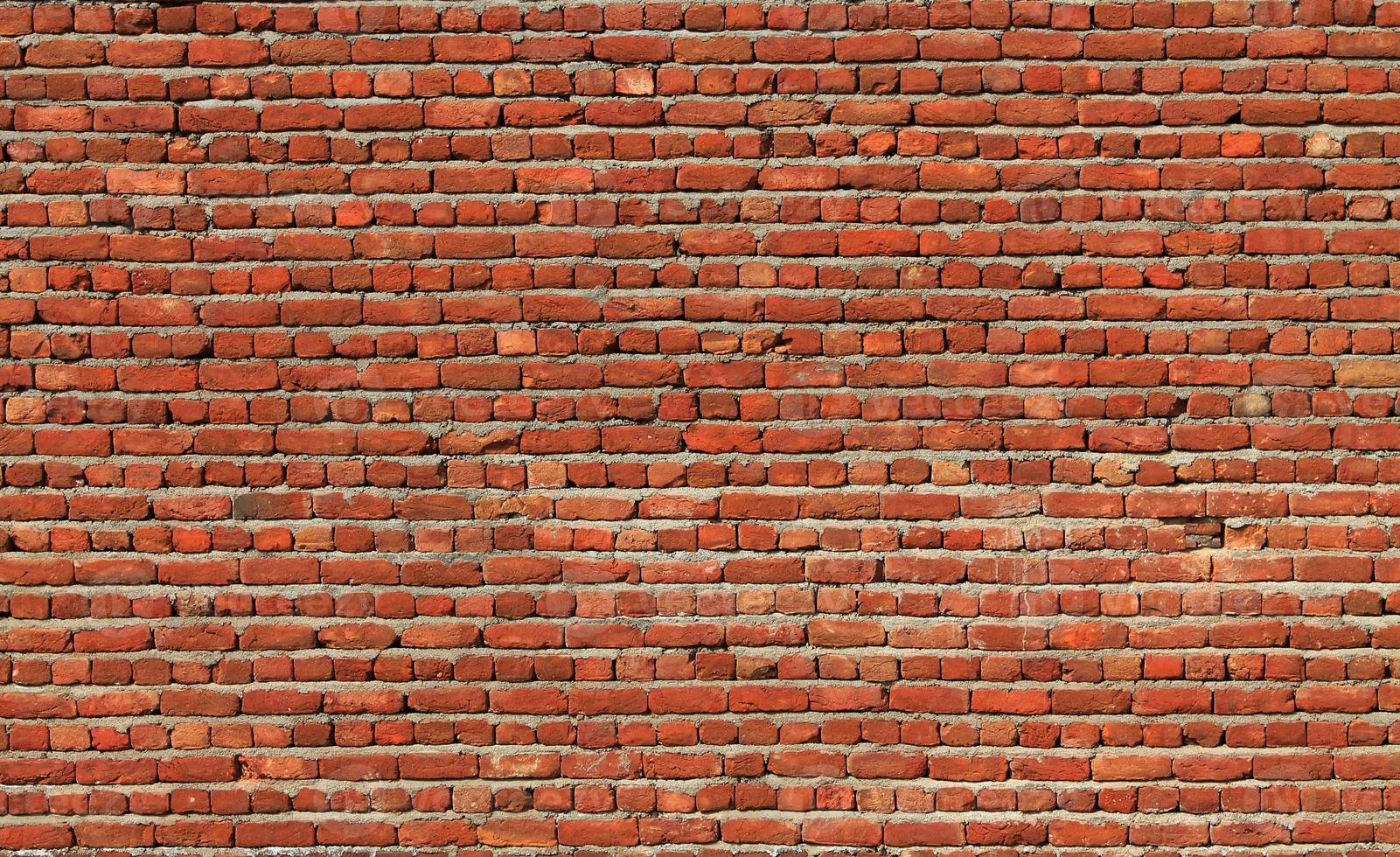 fondo del primo piano del muro di mattoni rossi foto