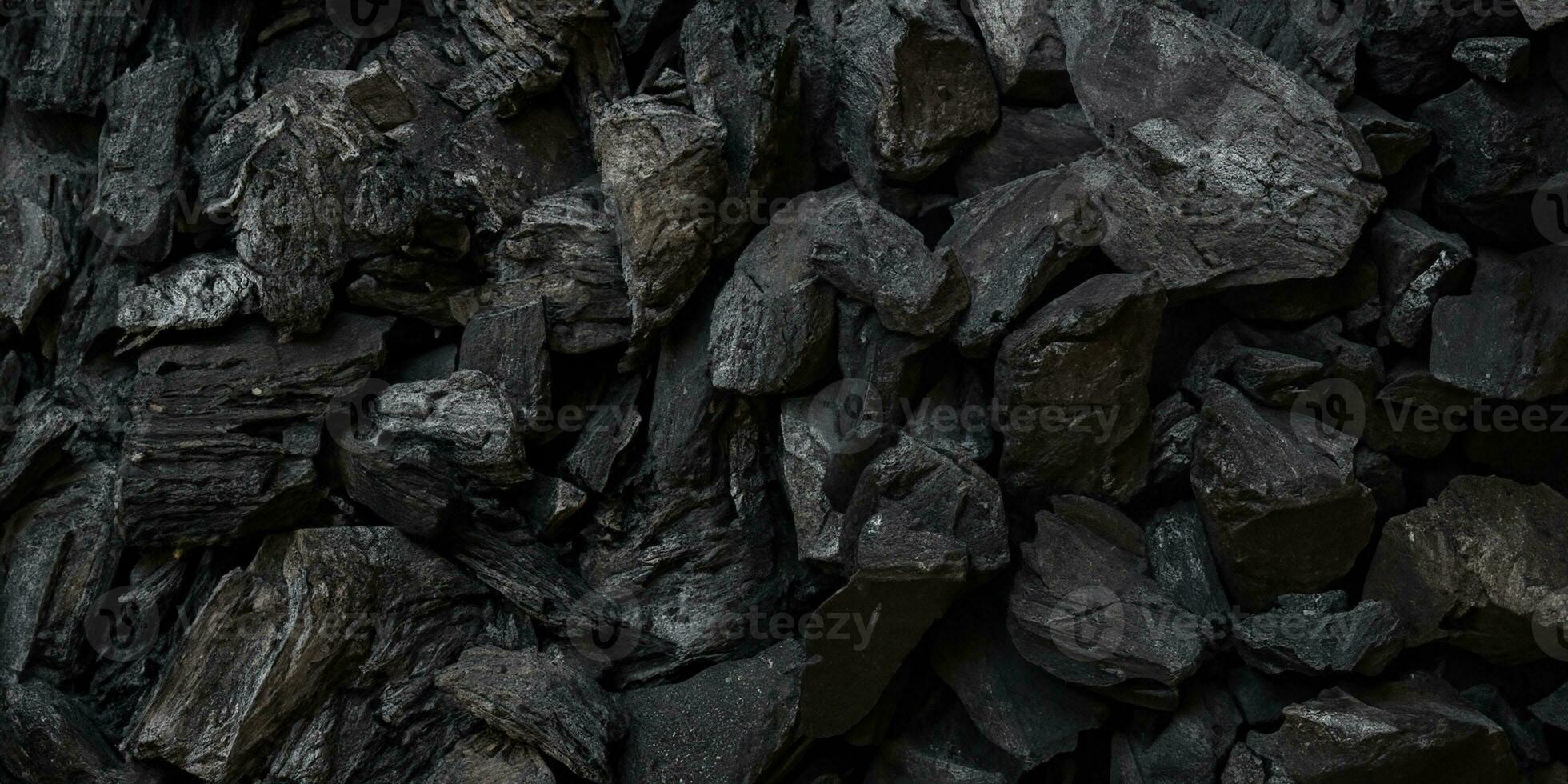 nero carbone sfondo. carbone legnoso nero. lotto di legna foto