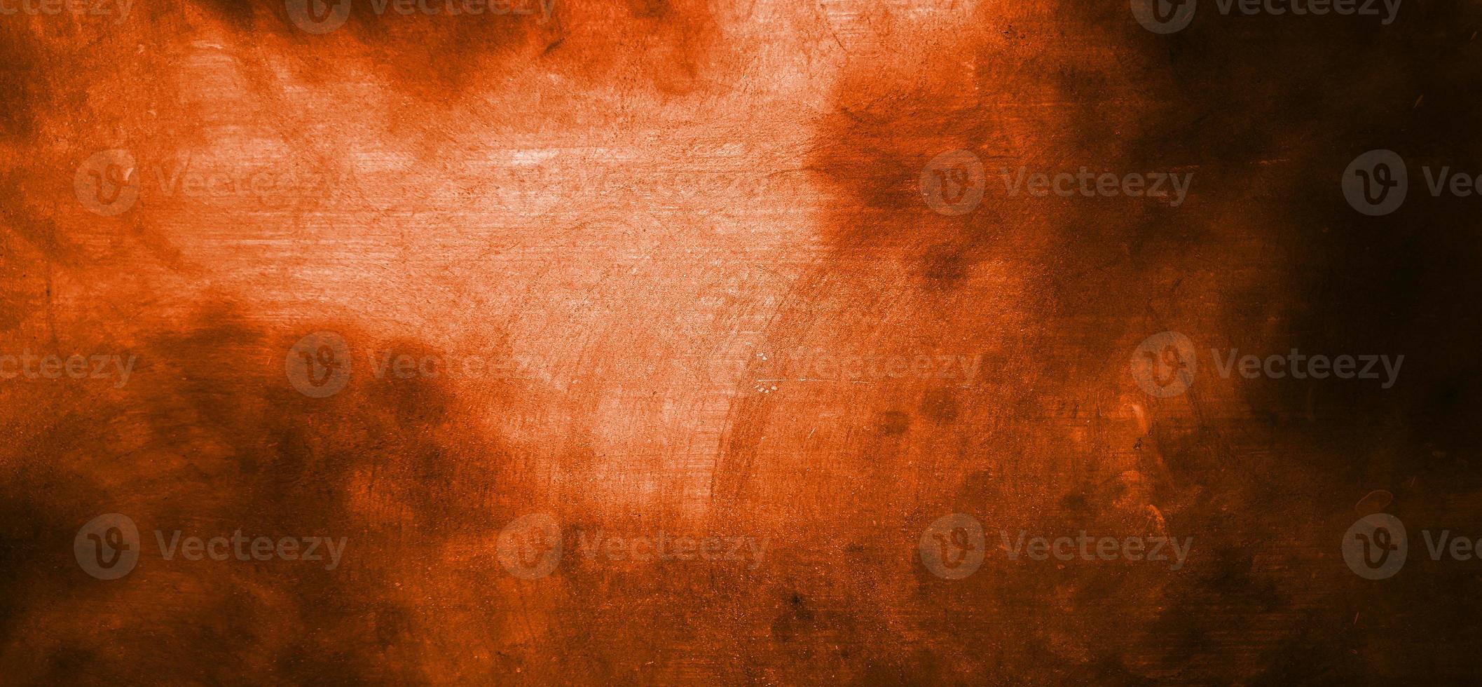 parete arancione con ombre scure. cemento arancione scuro per lo sfondo foto