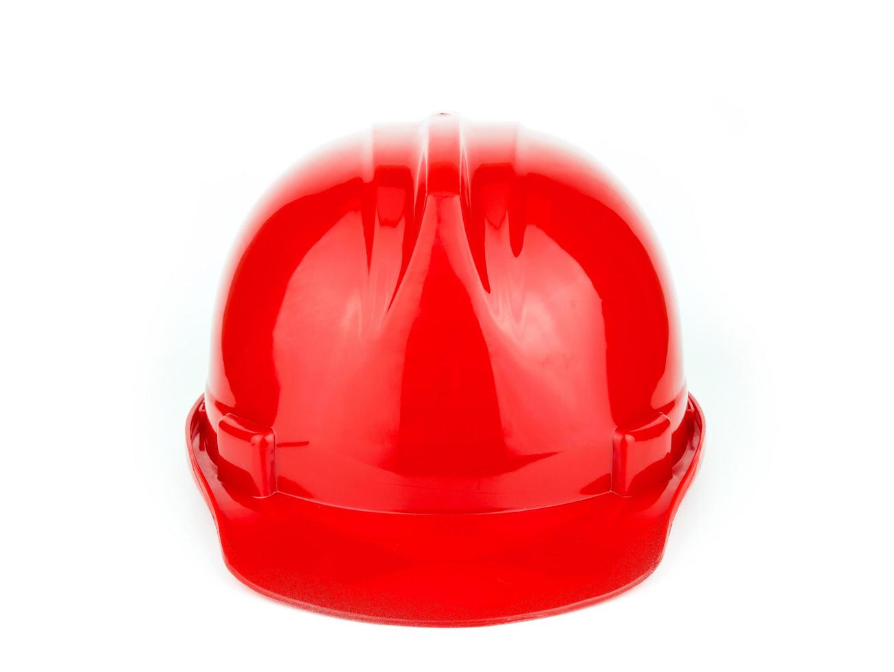 casco di sicurezza da costruzione rosso isolato su sfondo bianco foto