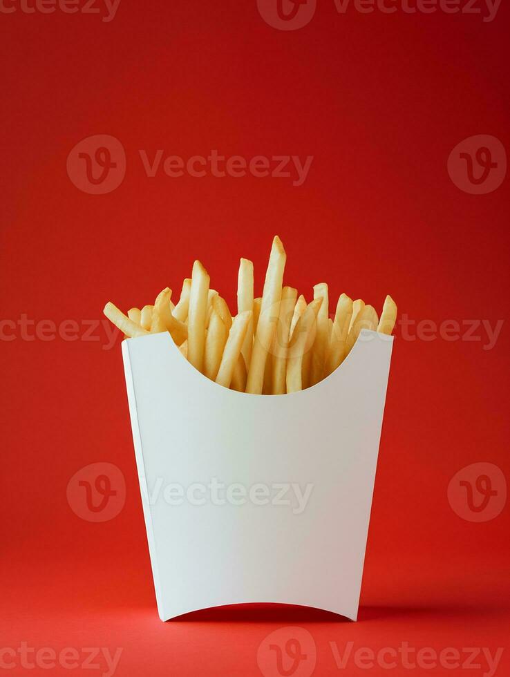 ai generato vuoto francese patatine fritte scatola modello nel pianura rosso isolato sfondo foto