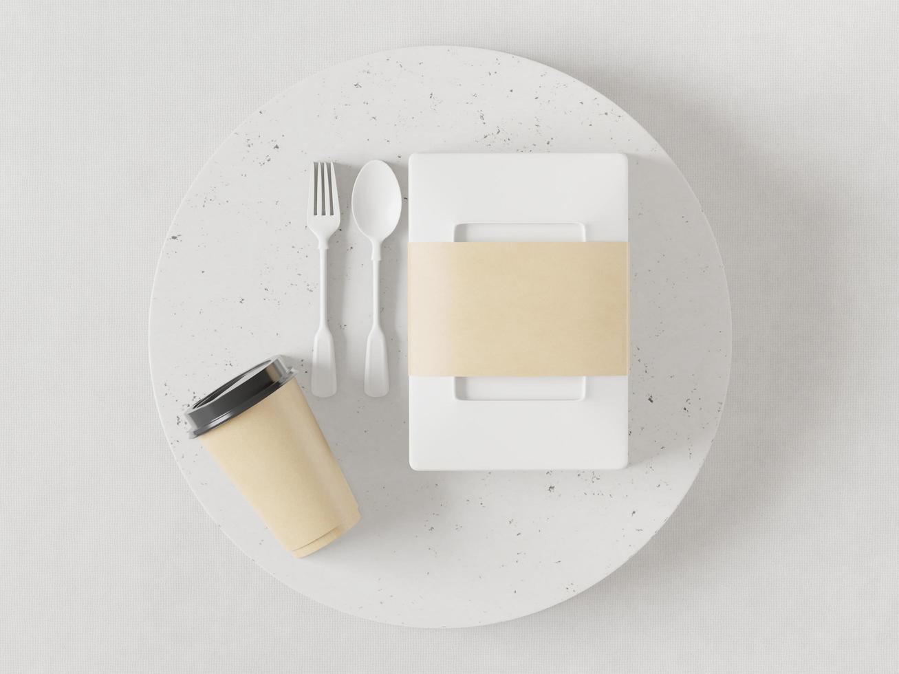 scatole per il pranzo, bicchieri, cucchiai di plastica e forchette posti su un piatto bianco. foto
