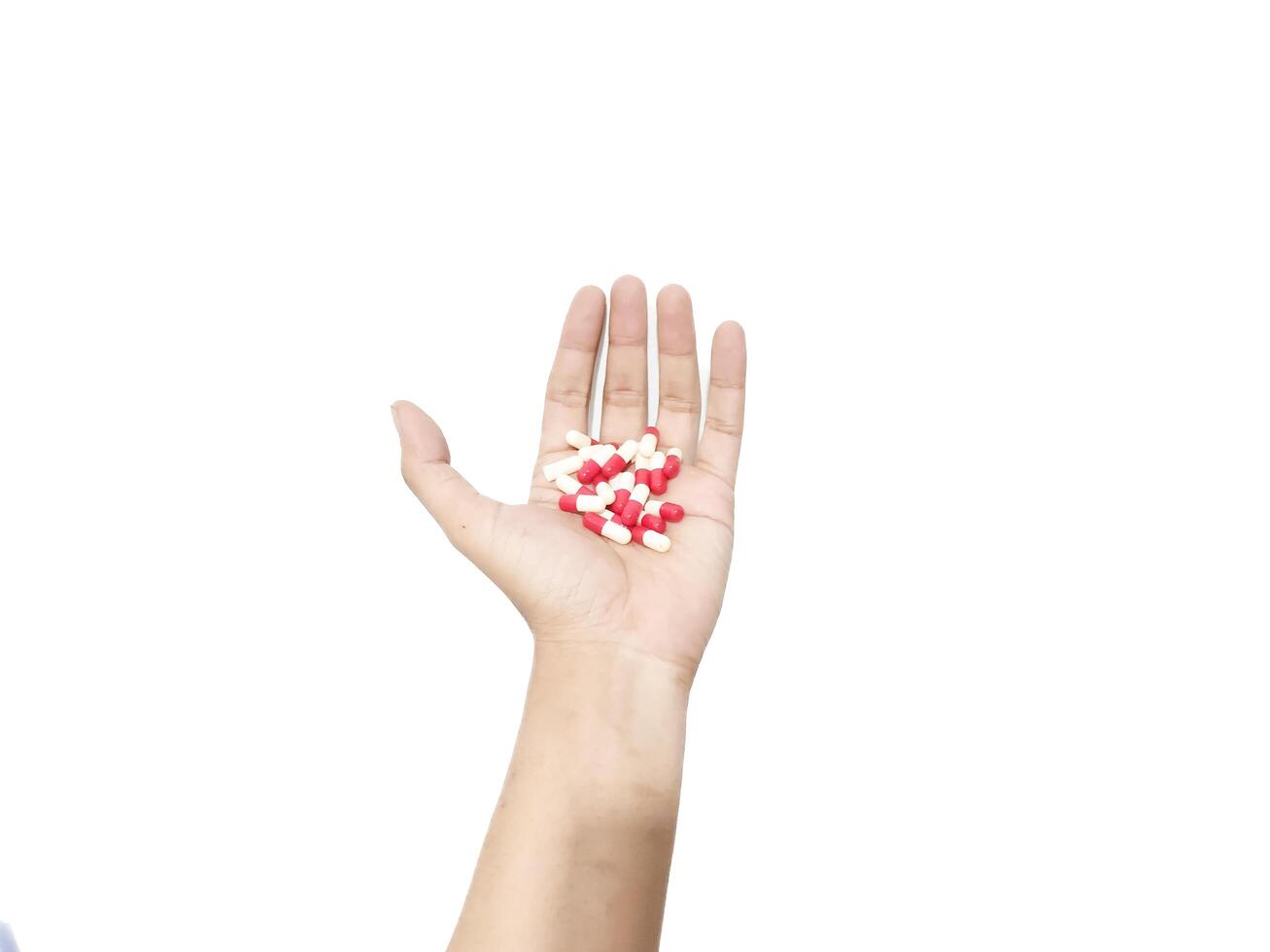 capsula pillole posto nel il palma di il mano isolato su un' bianca sfondo foto