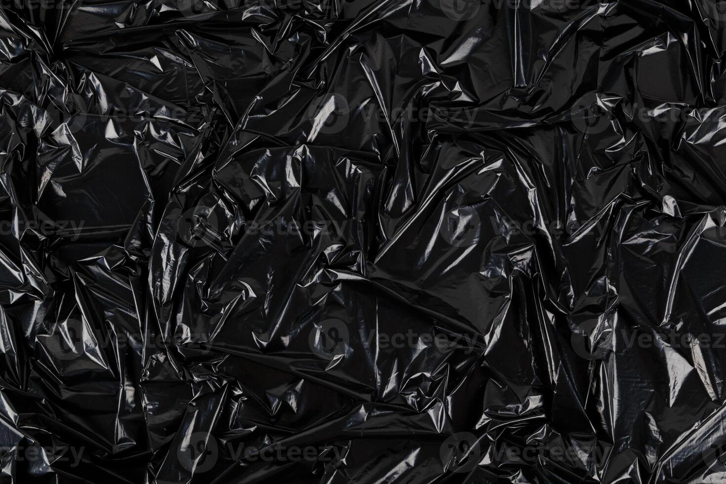pieno telaio astratto sfondo di spiegazzato nero plastica film Borsa foto
