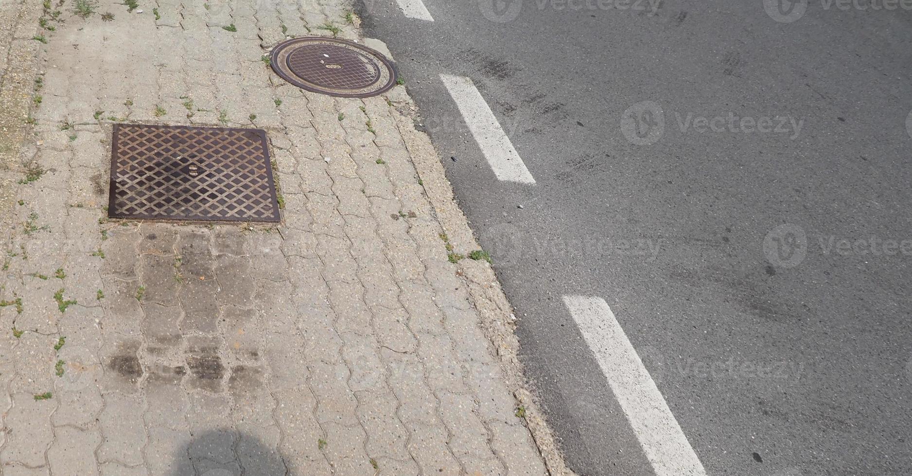 piastrelle di cemento per pavimentazione e sfondo di asfalto stradale foto