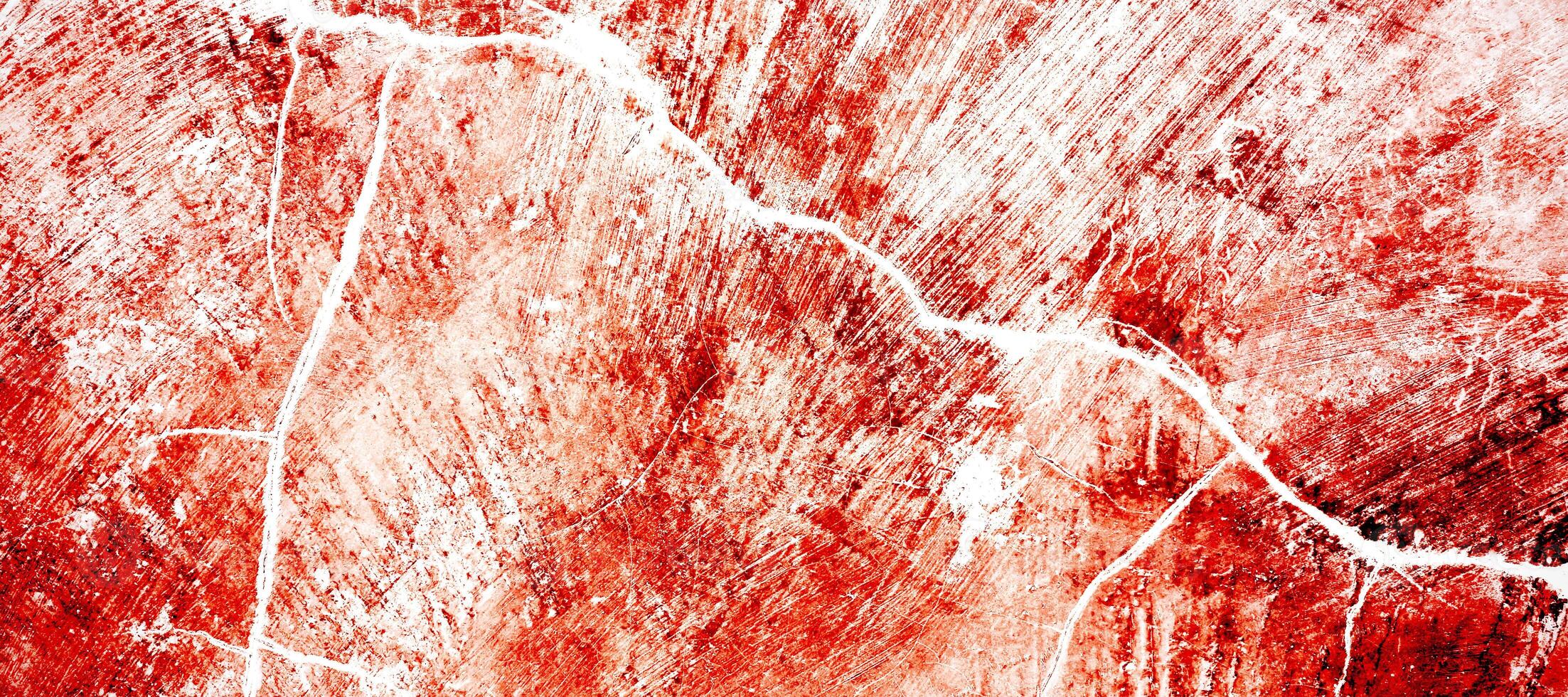 rosso sporco parete grunge struttura. astratto pauroso calcestruzzo, orrore cemento per sfondo. vecchio calcestruzzo parete. grunge sfondo per design. angosciato, sangue, incrinato, rotte, sbriciolato foto