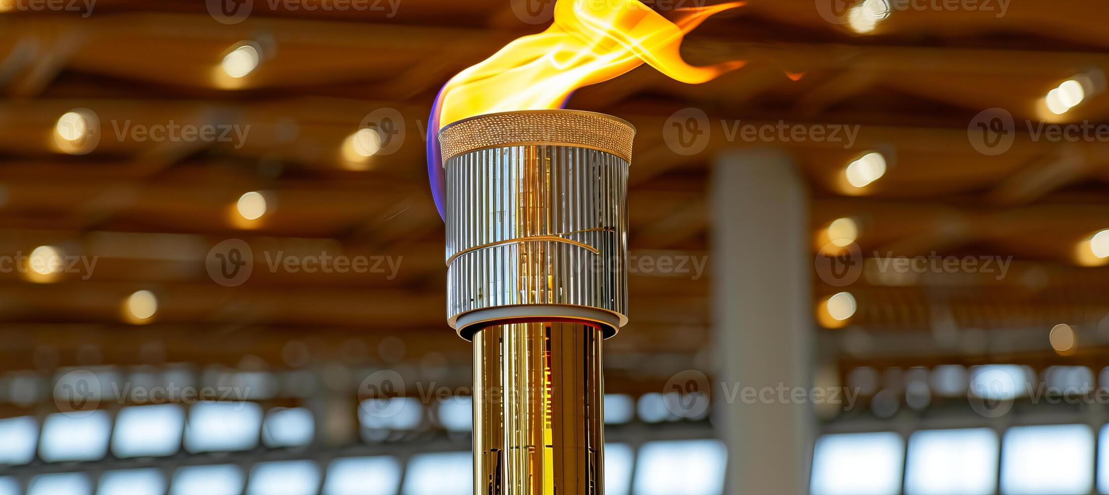 ai generato olimpico torcia fiamma ardente nel sfocato gli sport arena con copia spazio per testo posizionamento foto