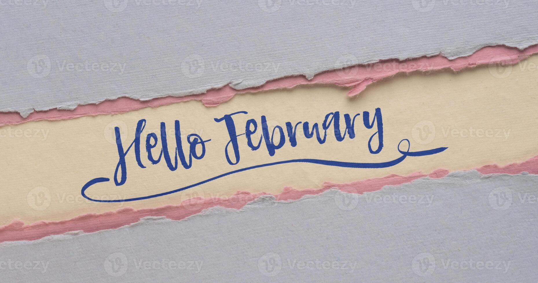 Ciao febbraio - grafia su un' fatto a mano carta, calendario concetto, ragnatela bandiera foto