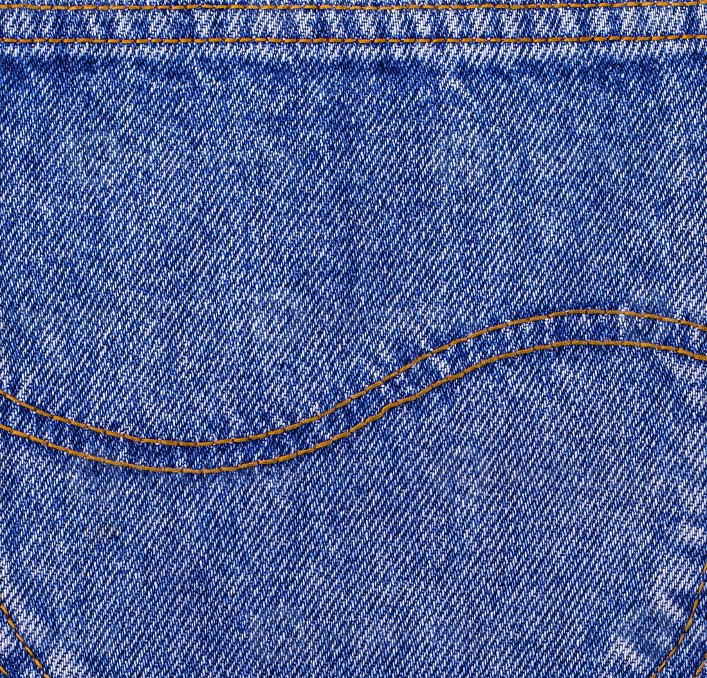 superficie di indietro tasca di jeans come sfondo. selettivo messa a fuoco foto