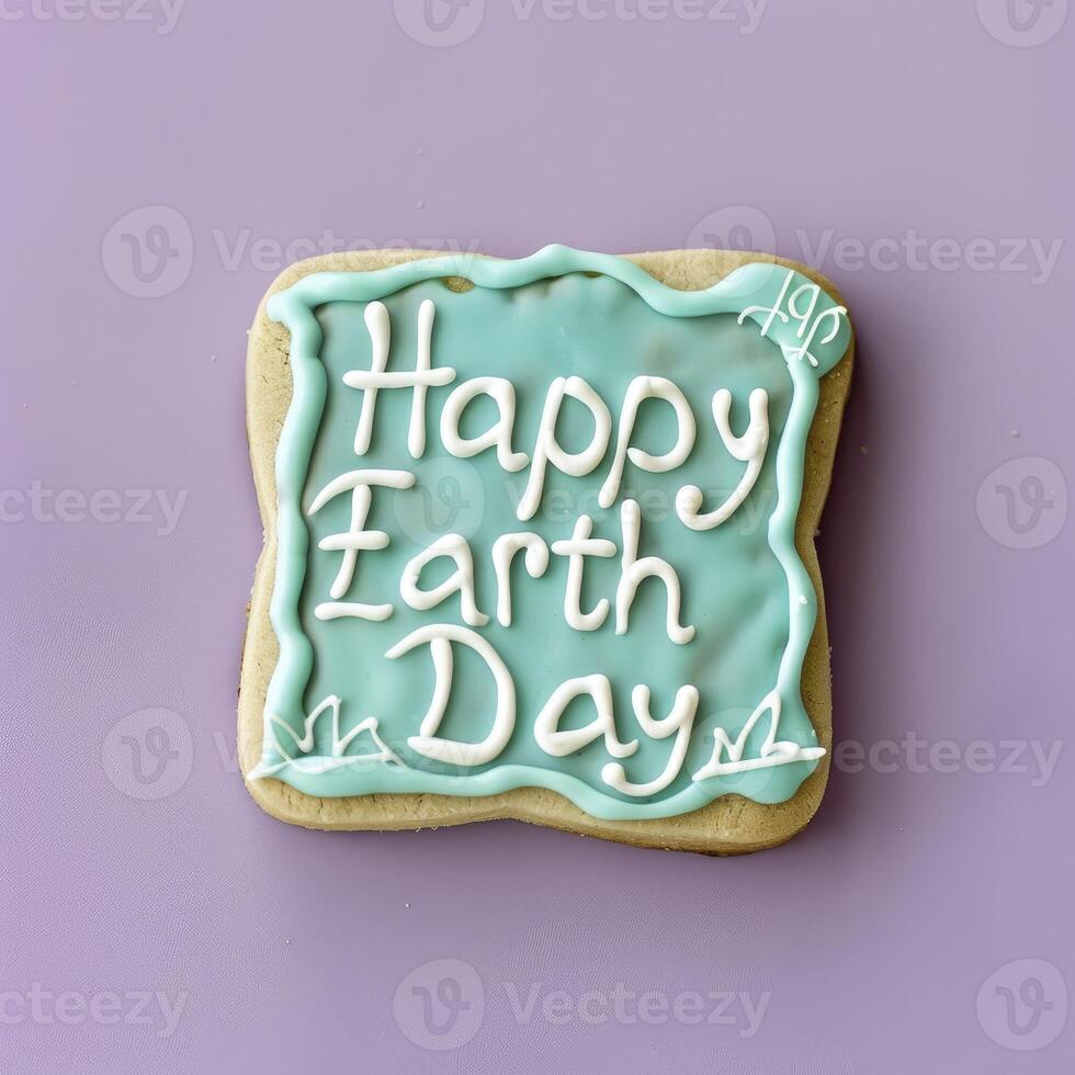 ai generato contento terra giorno, il testo su il blu e bianca zucchero biscotto foto