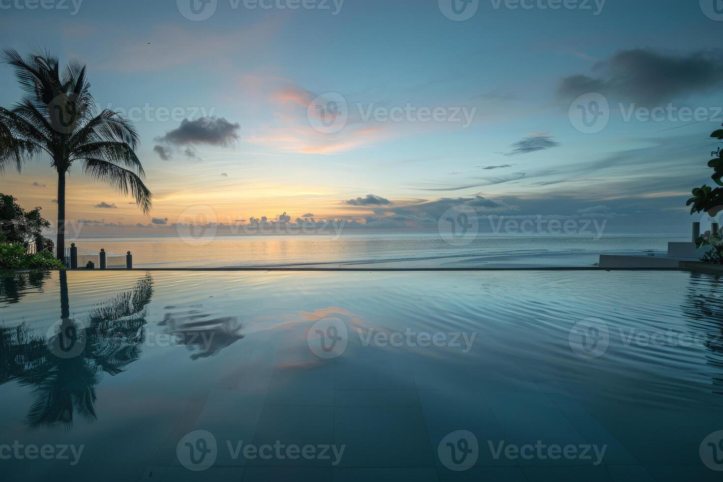 ai generato un' sereno Hotel infinito piscina a Alba con palma alberi liner il bordo e il vasto oceano allungamento su nel il sfondo. foto