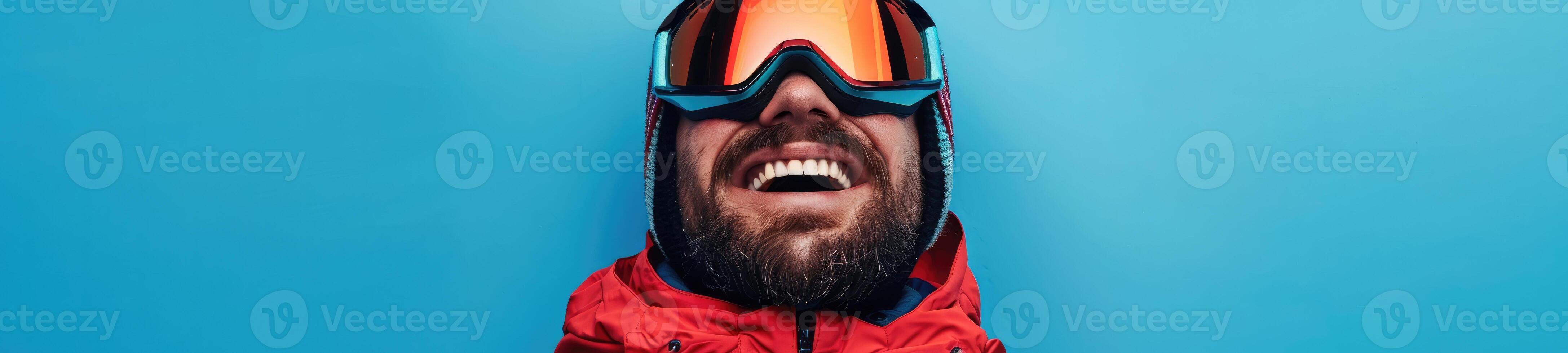 ai generato sorridente uomo con un' barba nel sciare attrezzatura su un' blu sfondo foto
