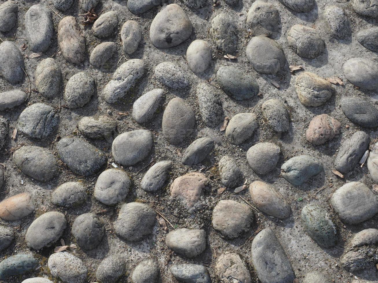 fondo di struttura dei ciottoli di pietra grigia foto