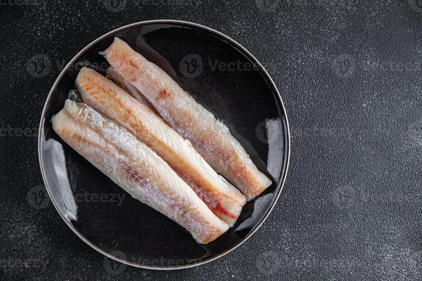 pesce nasello crudo filetto fresco frutti di mare gustoso cibo mangiare cucinando aperitivo pasto cibo merenda su il tavolo copia spazio cibo sfondo foto