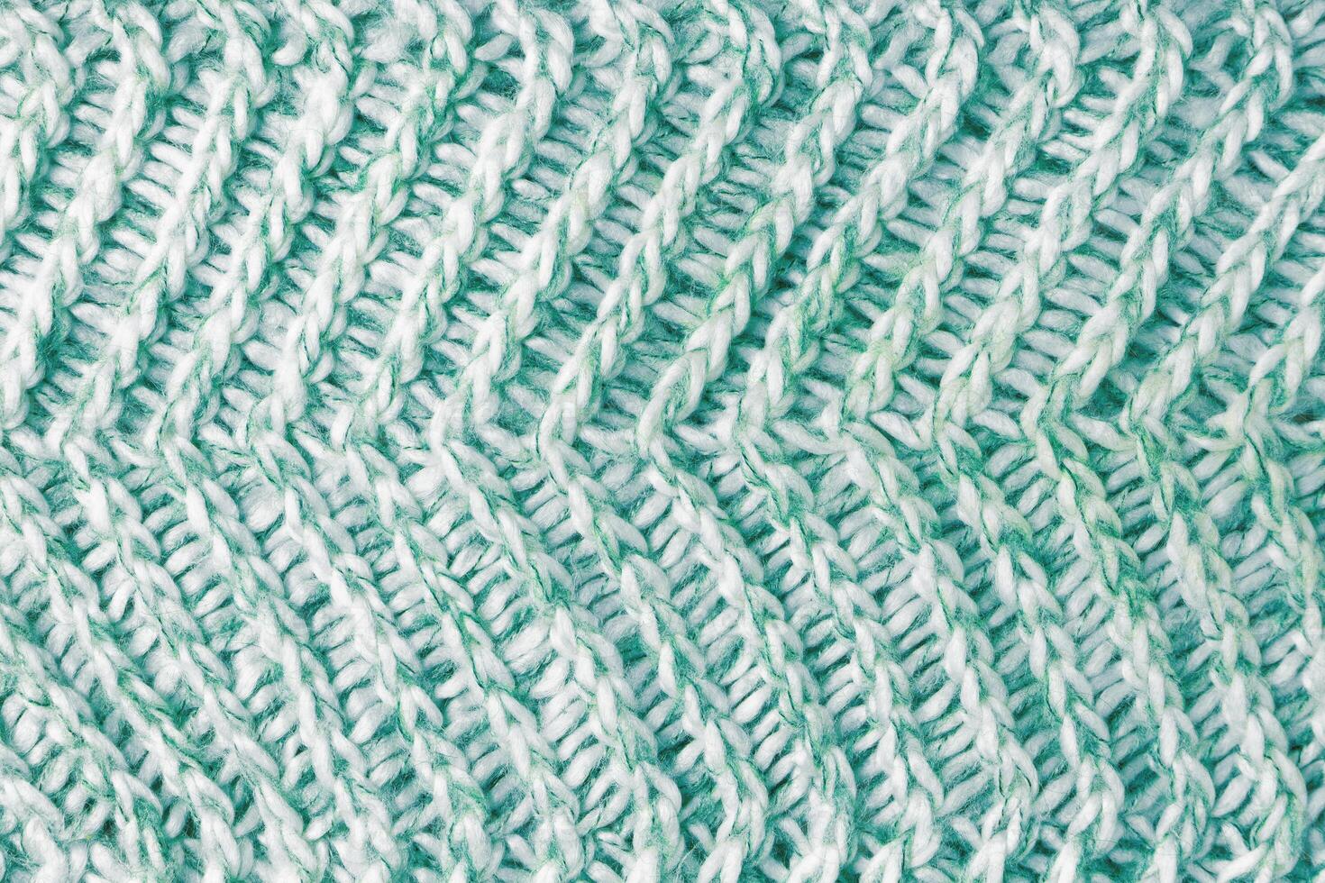 maglia tessile sfondo , verde bianca melange a maglia tessuto, stoffa superficie foto