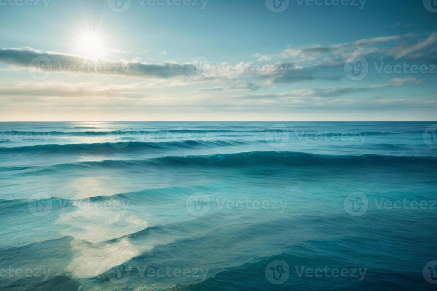 blu oceano onde e sole raggi nel il oceano foto