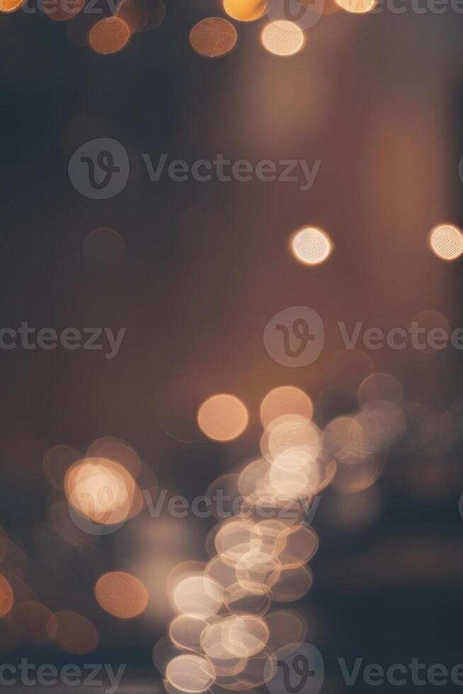 un' sfocato Immagine di un' strada a notte con luci foto