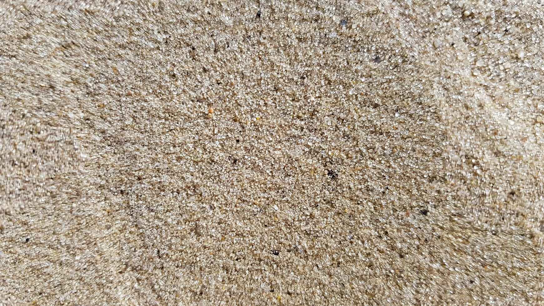 vista dall'alto della spiaggia di sabbia. sfondo con copia spazio e trama di sabbia visibile. fondo di sabbia fine. sfondo sabbia foto