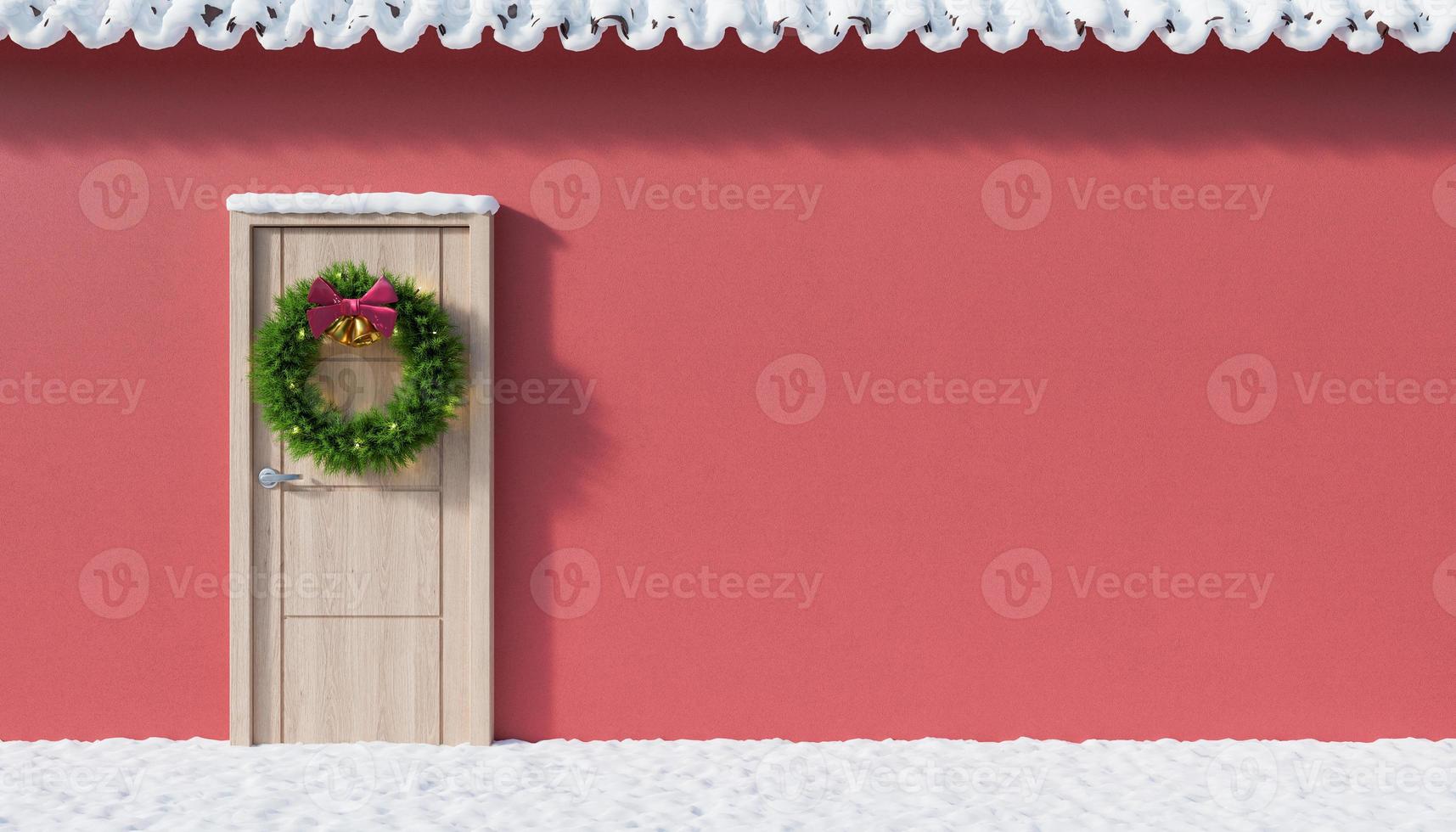 facciata con neve e una porta decorata per natale. foto