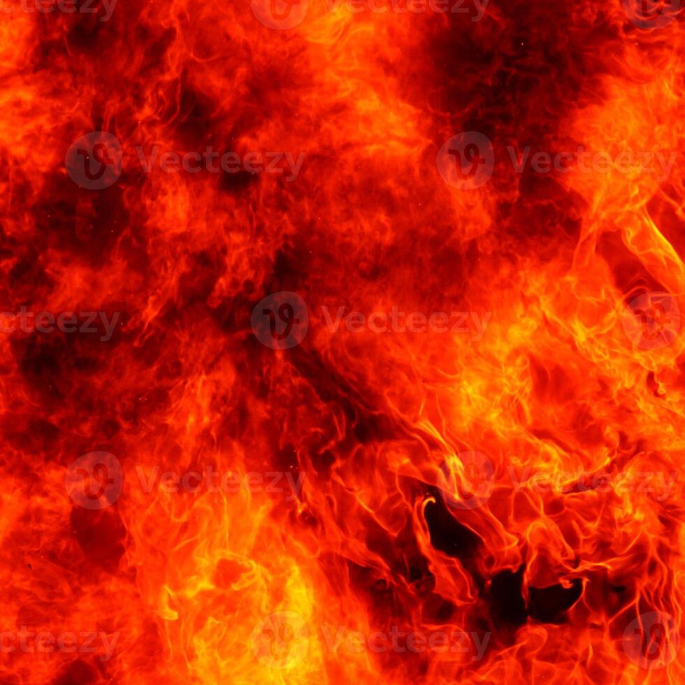 fuoco rosso chiaro e giallo fiamme che bruciano e scintille di fuoco particelle su nero rosso. foto